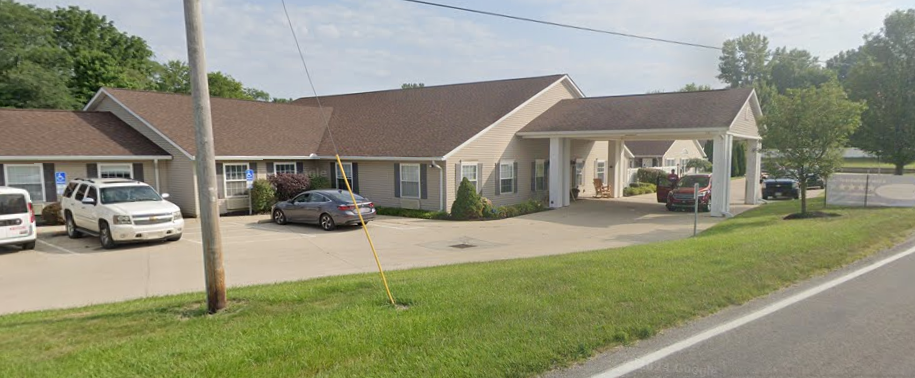 A house with a lawn and a car