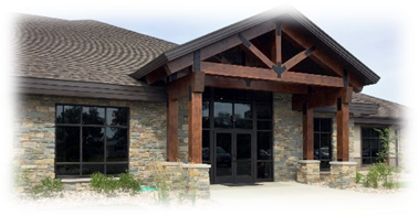 A building with a stone and wood front door
